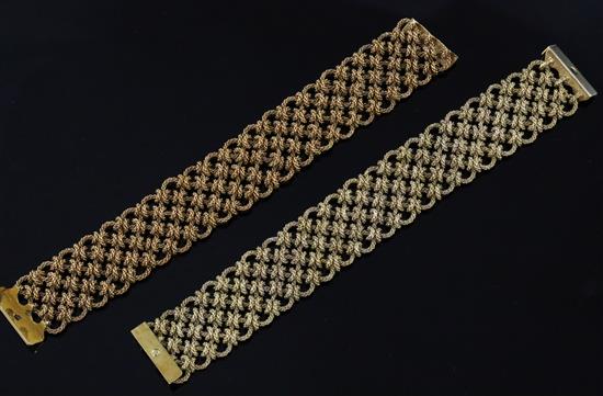 A near pair of early 1970s import marked textured 18ct gold knot link bracelets,